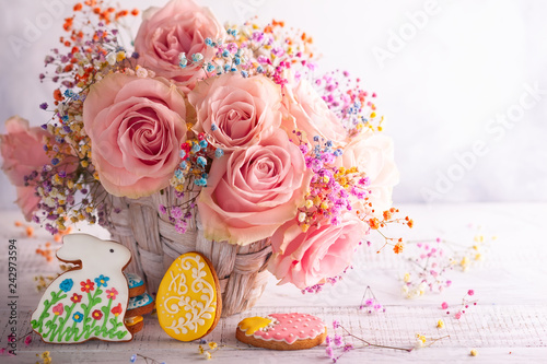 Easter composition with flowers and cookies.