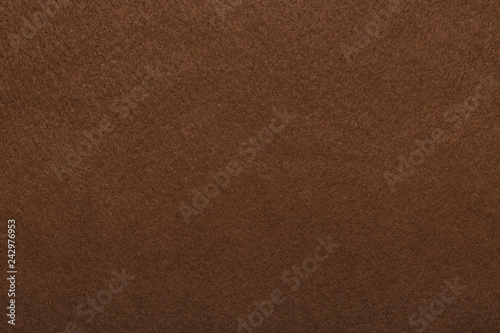 Textured background of felt fiber brown