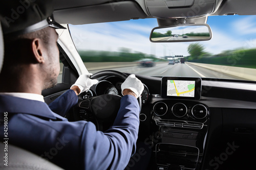 Male Chauffeur Driving Car © Andrey Popov