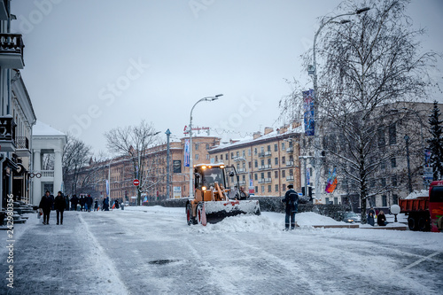 MINSK, BELARUS - 12 YANUARY, 2019: workers and snow machines remove snow in the city center after a snowfall