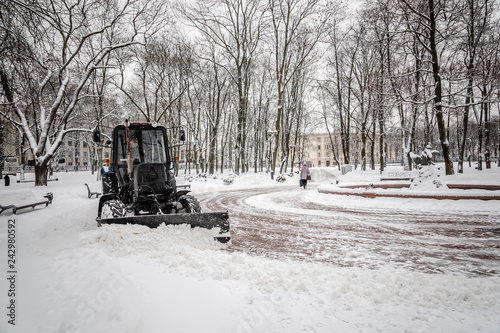 MINSK, BELARUS - 12 YANUARY, 2019: workers and snow machines remove snow in the city center after a snowfall
