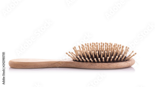 Wooden comb with black hair loss problem studio shot and isolated on white