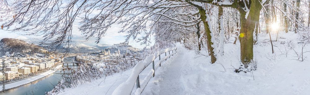 Walking promenade in Salzburg, snowy winter landscape Walking promenade in Salzburg, snowy winter landscape