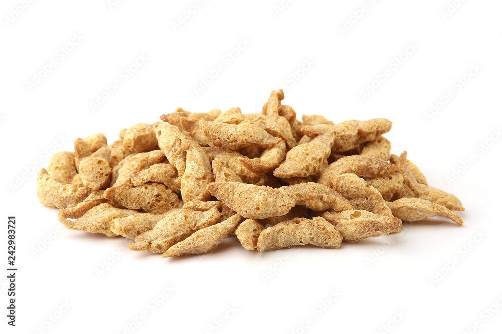 Raw soy chunks pile isolated on white background. Dry soya pieces meat used in vegetarian and vegan food. Raw soy chunks pile isolated on white background. Dry soya pieces meat used in vegetarian and vegan food.