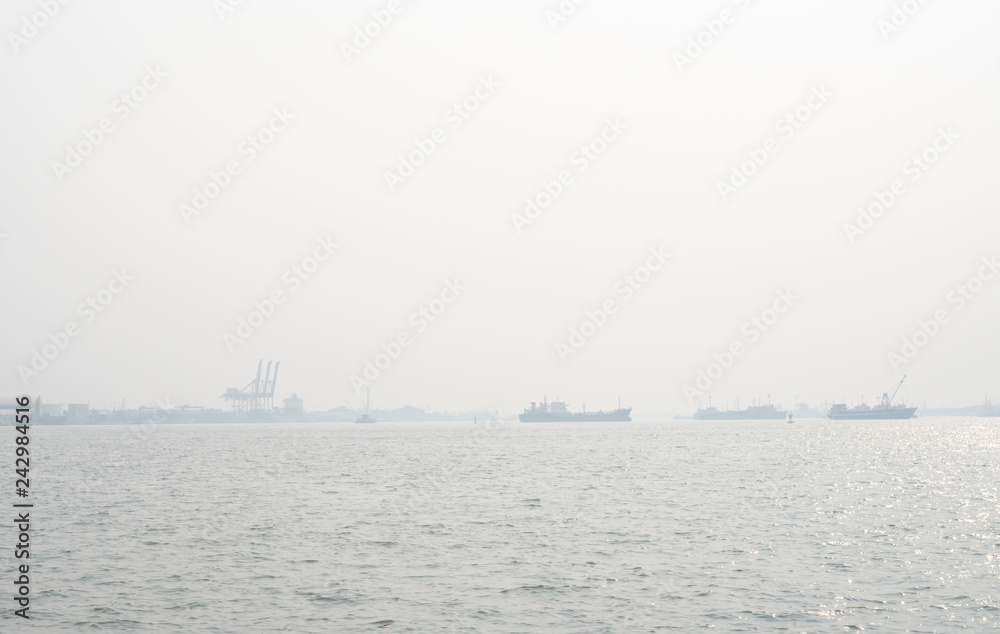 Air pollution at the pier. Bad air quality filled with dust causes of respiratory diseases. Global warming from air pollution problem. Environmental problem from gas carbon monoxide and dust. PM 2.5 Air pollution at the pier. Bad air quality filled with dust causes of respiratory diseases. Global warming from air pollution problem. Environmental problem from gas carbon monoxide and dust. PM 2.5