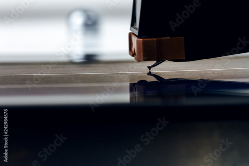 Close up of turntable needle on a vinyl