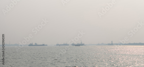 Air pollution at the pier. Bad air quality filled with dust causes of respiratory diseases. Global warming from air pollution problem. Environmental problem from gas carbon monoxide and dust. PM 2.5