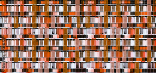 Graphic facade building of skyscraper - coral color