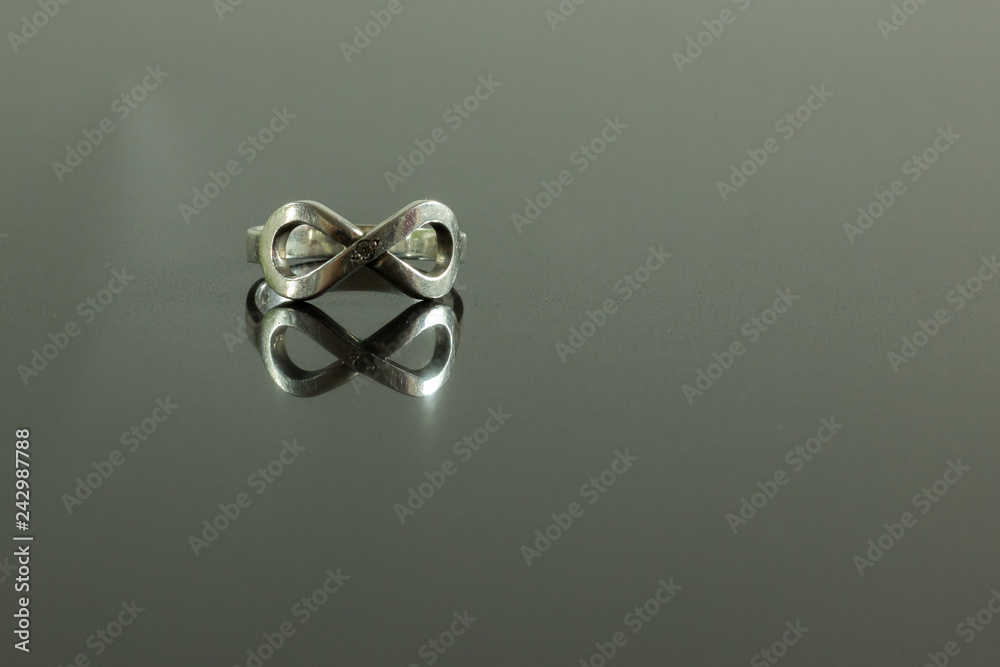 infinity ring with reflection isolated on black infinity ring with reflection isolated on black