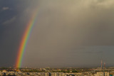 Colorful rainbow over the city