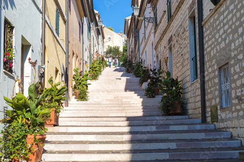 Fototapeta Naklejka Na Ścianę i Meble -  Numana Sirolo Ancona Mount Conero Marche region Italy - The stairway of old town Numana, beautiful tiny pearl of the Adriatic Sea
