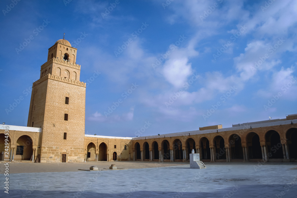 Great Mosque of Kairouan courtyard with minaret in Kairouan city in Tunisia also known as Mosque of Uqba