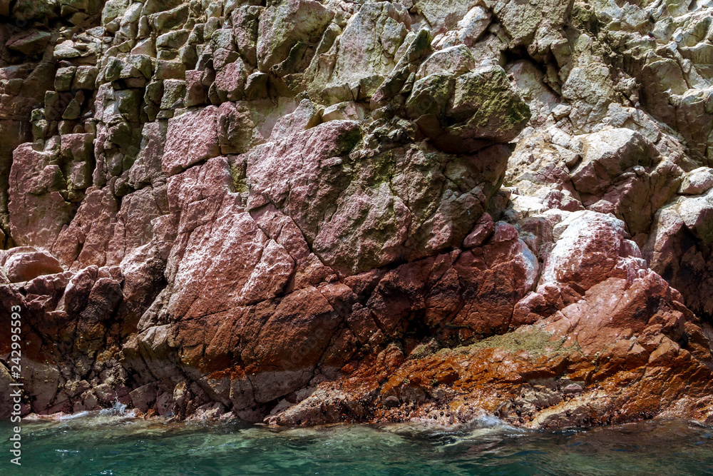Close-up of colored rock on the Ballestas Islands (Paracas, Peru)