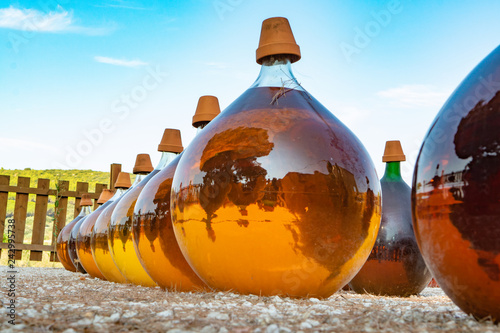 Принти на полотні Making of natural sweet dessert muscat liqueur white wine outside in big round g