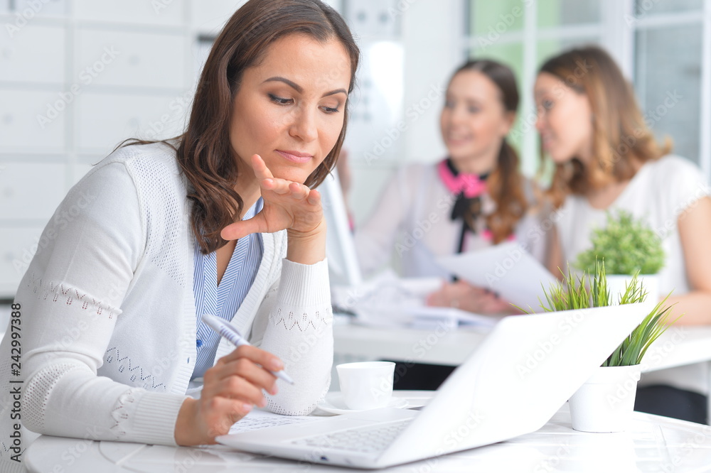 Portrait of young women working in modern office Portrait of young women working in modern office