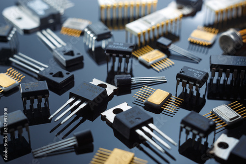 Electronic components close-up. Golden electronic microcircuits. photo