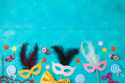Carnival or mardi gras background with carnival masks and photo booth props.