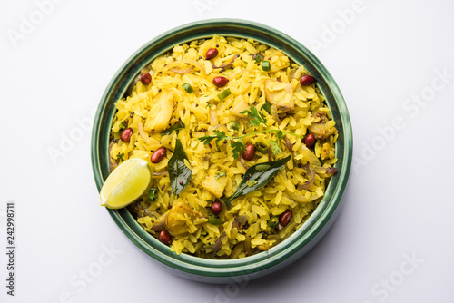 Aloo/Kanda Poha or Tarri Pohe with spicy chana masala/curry. selective focus