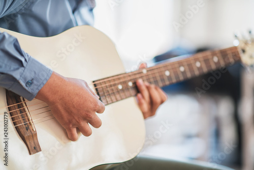 Man playing guitar , close up