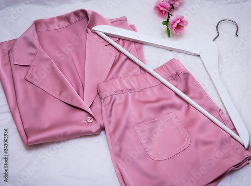women's silk pink pajamas with hanger and flowers photo