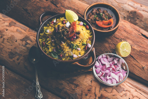 Aloo/Kanda Poha or Tarri Pohe with spicy chana masala/curry. selective focus photo