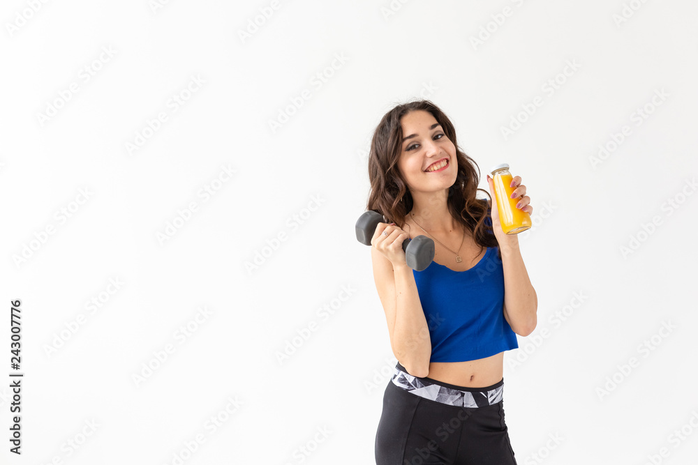 Healthy lifestyle, people and sport concept - Woman with healthy juice drinking for sport and fitness on white background with copy space Healthy lifestyle, people and sport concept - Woman with healthy juice drinking for sport and fitness on white background with copy space