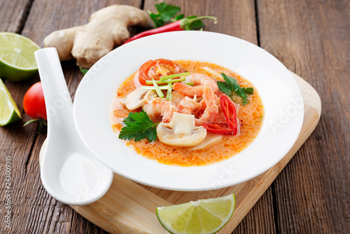 Thai food soup Tom Yam with Coconut milk, Chili pepper and Seafood.