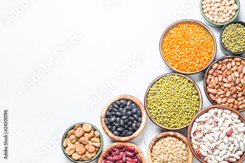 Legumes, lentils, chikpea and beans assortment on white. photo