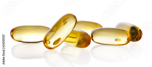 Close up of food supplement oil filled capsules suitable for: fish oil; omega 3; omega 6; omega 9; evening primrose; borage oil; flax seeds oil; vitamin A; vitamin D; vitamin D3; vitamin E