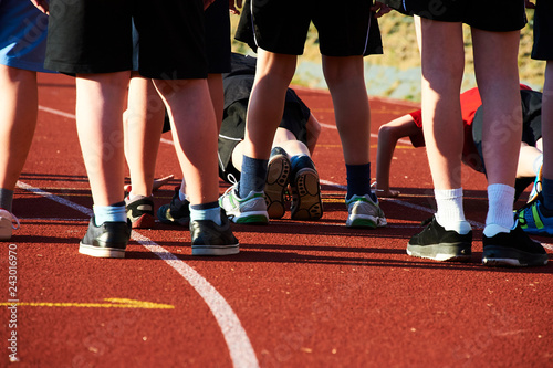 Children on athletic running track