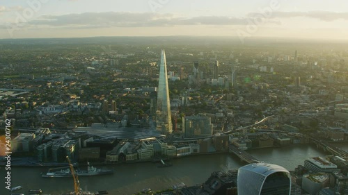 Aerial sunset view commercial skyscrapers River Thames London