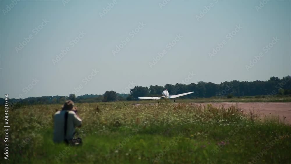 Aviation festival. Airfield of flying club. Small airplane aircraft accelerates, takes off from the runway. Light engine small aviation Aviation festival. Airfield of flying club. Small airplane aircraft accelerates, takes off from the runway. Light engine small aviation