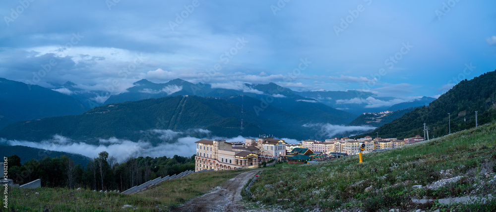 Evening panoramic view of the complex of hotels in mountains