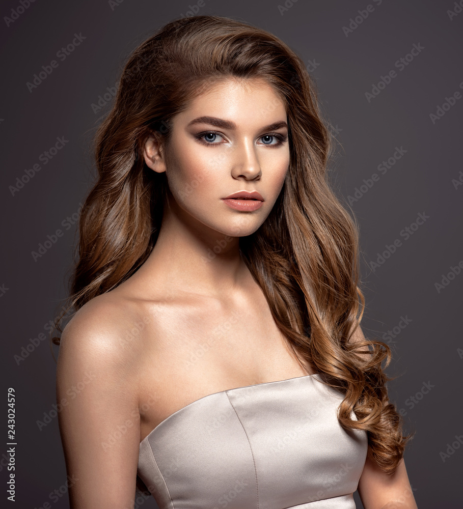 Sexy and gorgeous brown-haired woman with long curly hair. Stock Photo |  Adobe Stock
