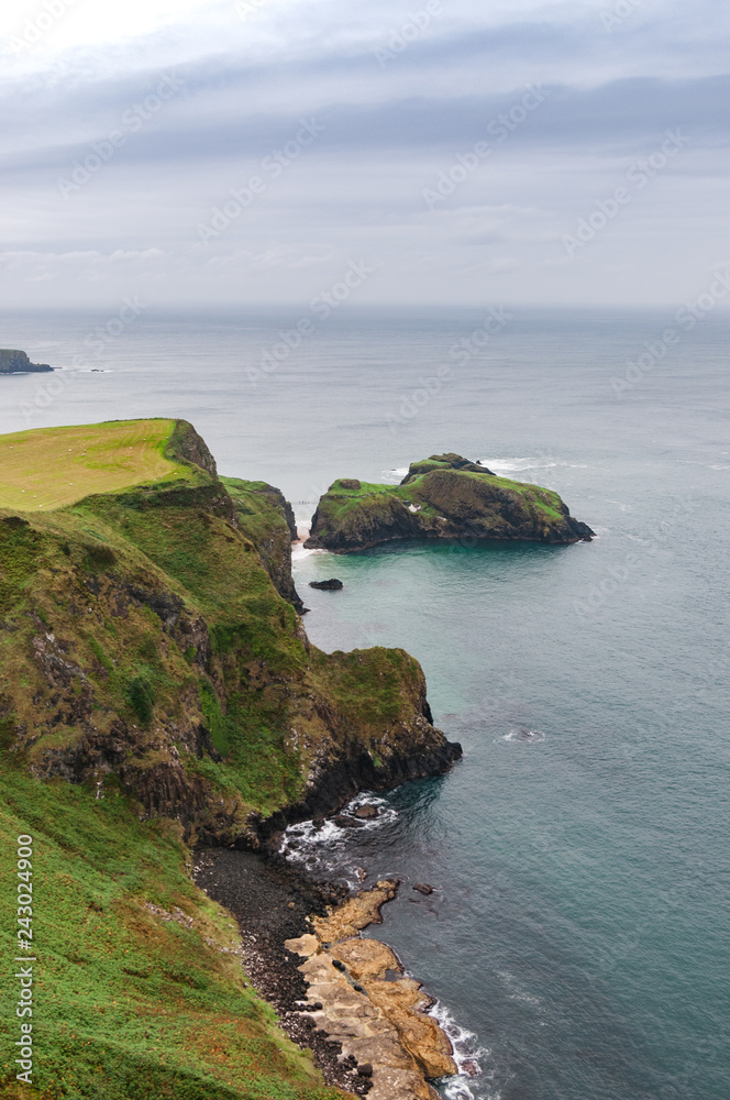 The view toward Carrick-a-Rede rope bridge of surrounding sea and island, Northern Ireland