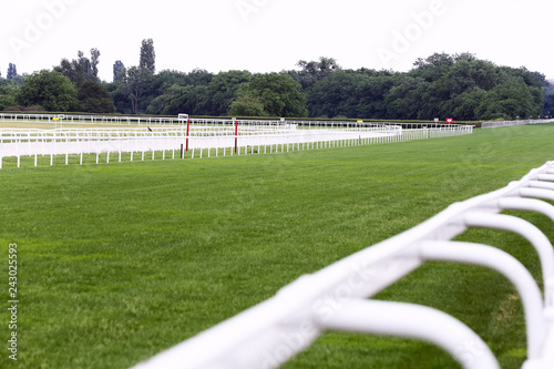 Empty racing track racecourse without horses and riders photo
