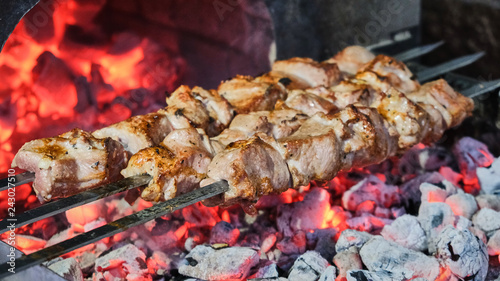 Cook roasts juicy kebab barbecue on the grill slowmotion