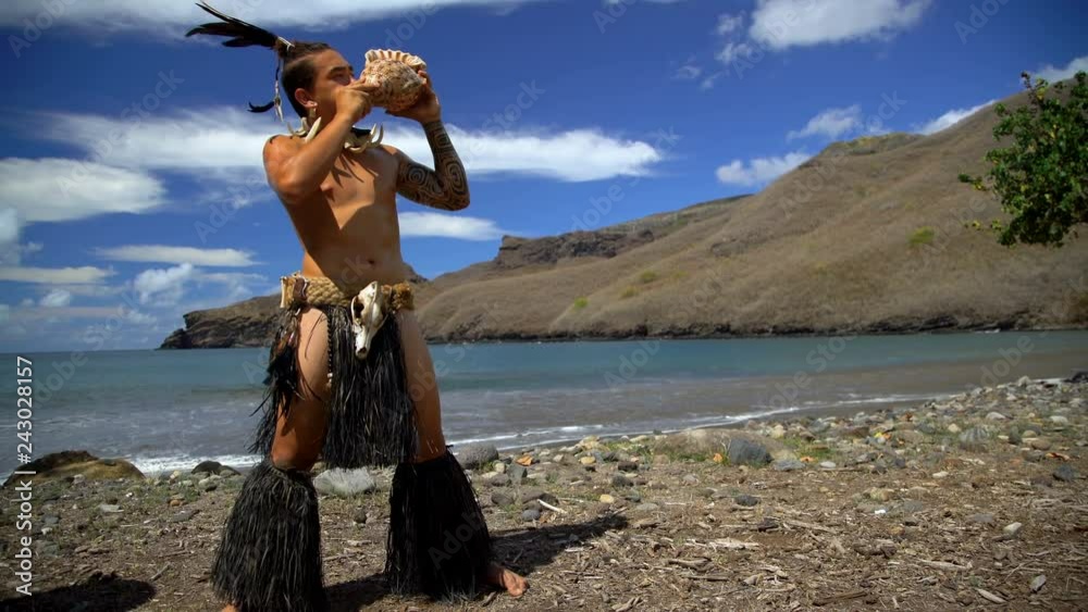 Marquesas male blowing conch shell Nuku Hiva Marquesas