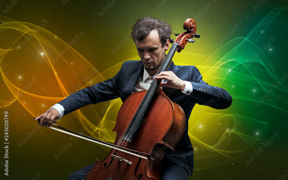 Fototapeta premium Serious classical cellist with fabled sparkling wallpaper