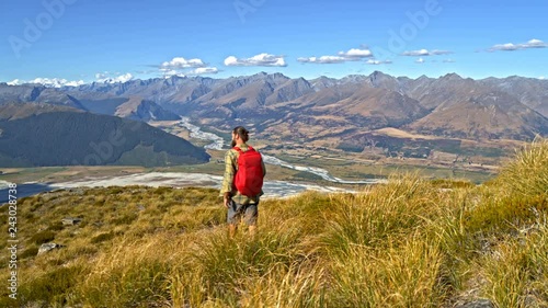 Aerial of male hiker hiking Fjordland New Zealand photo