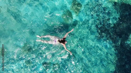 Wallpaper Mural Aerial Woman swimming breaststroke in azure sea Torontodigital.ca