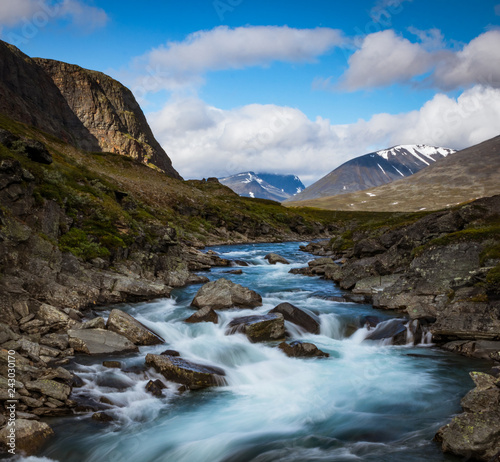 Flowing water in a river during the hike of Kungsleden  Kings path  in northern Sweden. 