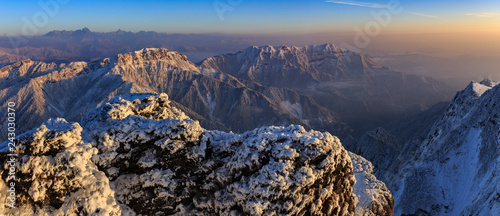 Dawn, Sunrise above the clouds - Niubeishan Landscape, Cattle Back Mountain, Sichuan Province China. Snow mountains, Ice Frost and Rime. Frozen Winter Landscape, Panoramic View. Sea of Clouds photo