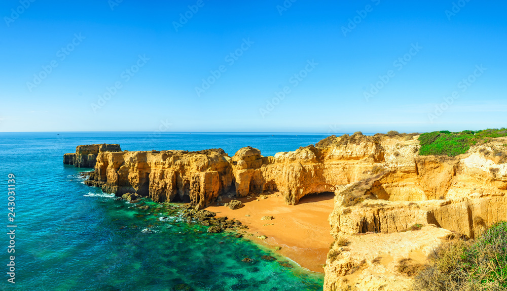 panoramic view of Portugal beach among rocks and cliffs near Albufeira in Algarve