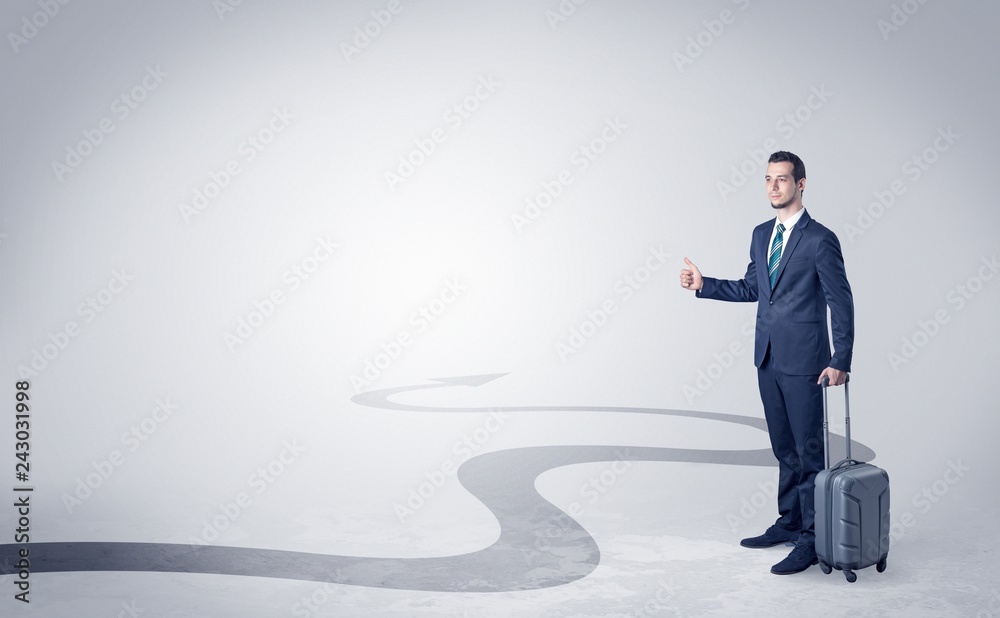Young businessman hitchhiking with progressive arrow concept and copyspace
Young businessman hitchhiking with progressive arrow concept and copyspace