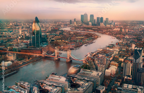 London view at sunset. Panorama include river Thames, Tower bridge and City of London and Canary Wharf  buildings.