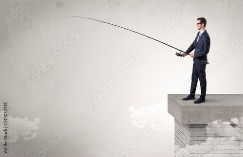 Businessman fishing nothing from the cloud with free copyspace
