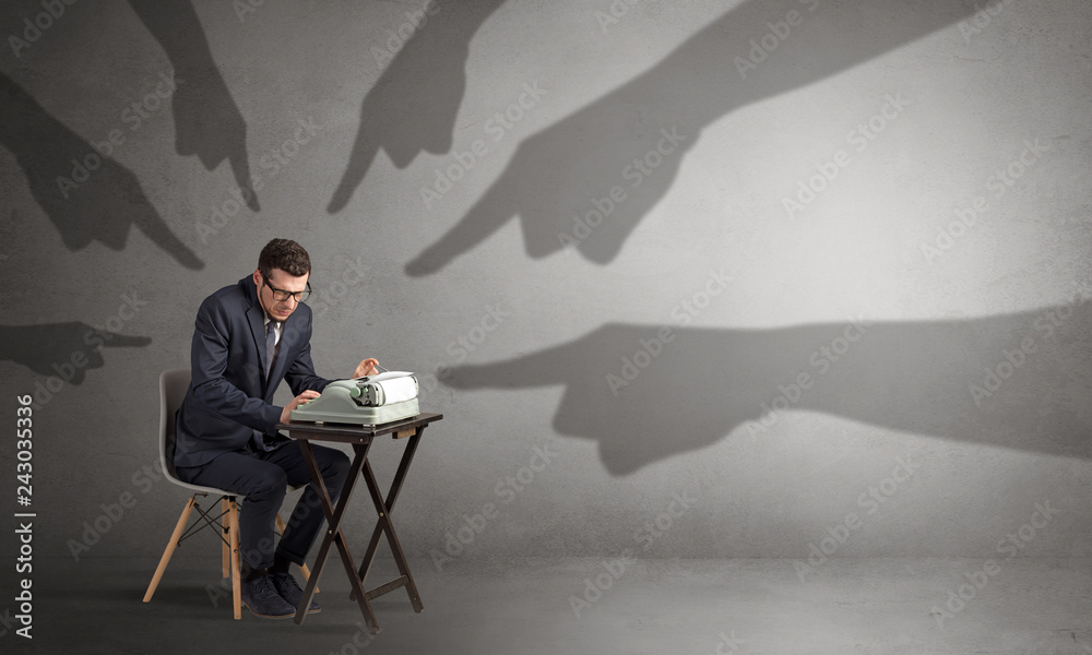 Shadow hand pointing at a small afraid worker
Shadow hand pointing at a small afraid worker