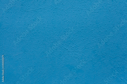 Blue painted stucco wall. Background texture.