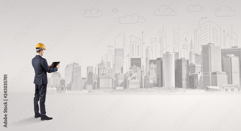 Young supervisor architect standing and replanning a big city panorama
Young supervisor architect standing and replanning a big city panorama